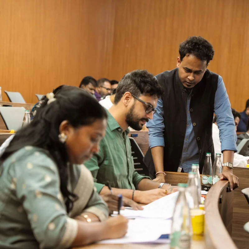 Participants working with a facilitator at PSPA’s Woxsen Leadership Lab