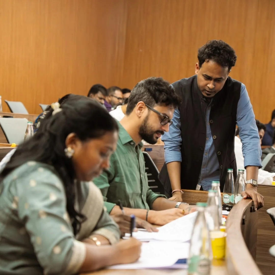 Participants working with a facilitator at PSPA’s Woxsen Leadership Lab